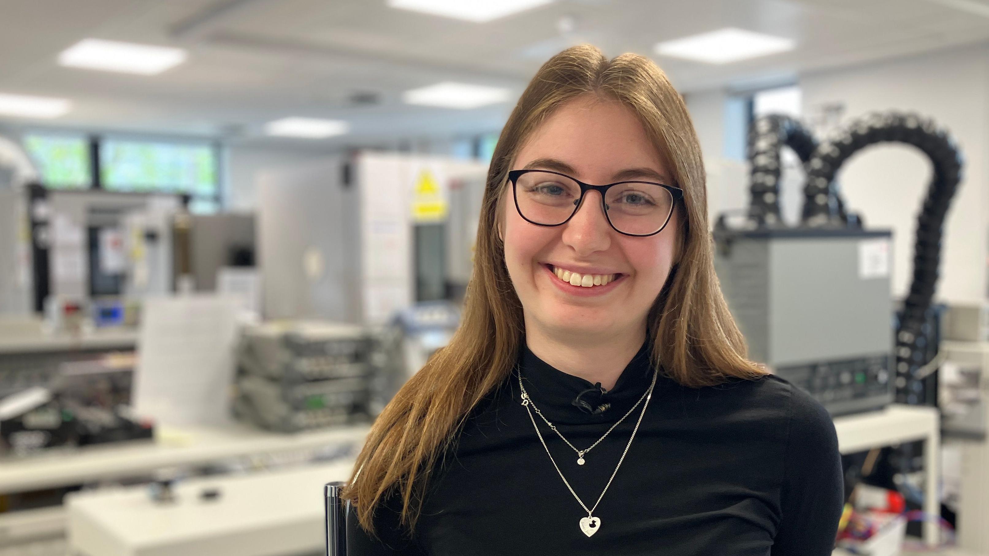 Professional woman using laptop at desk